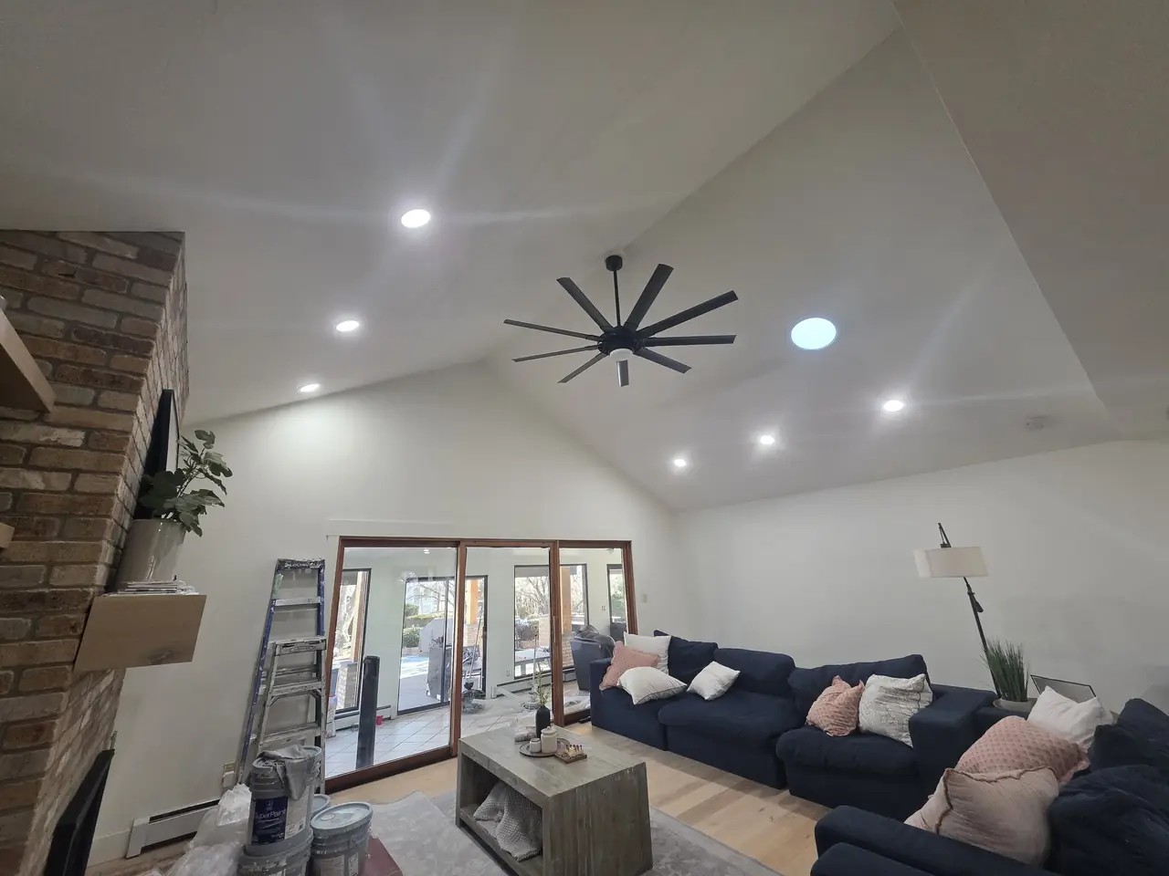 Bright vaulted great room with freshly painted white walls and ceiling